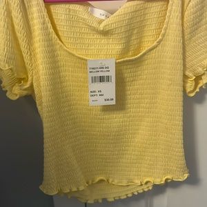 women yellow short sleeve top
